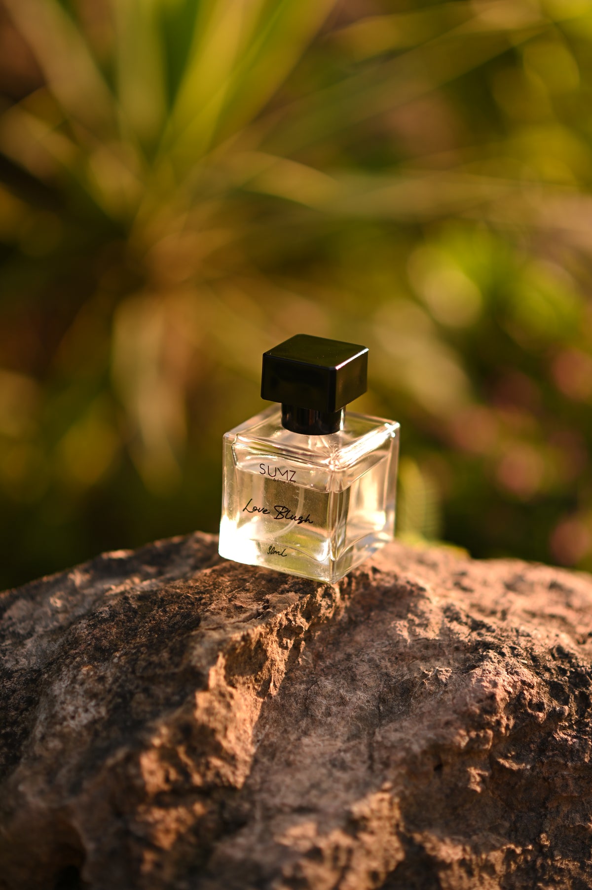 SUMZ Love Blush 50 ml hair perfume bottle outdoors