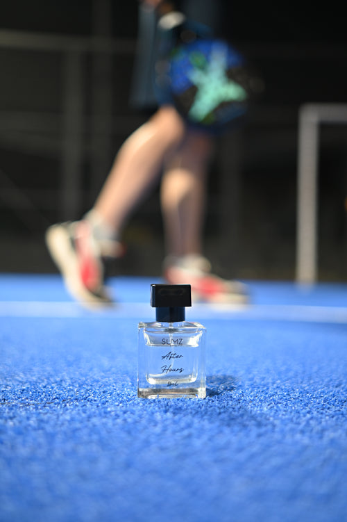 SUMZ After Hours 50 ml unisex hair perfume bottle on a blue court